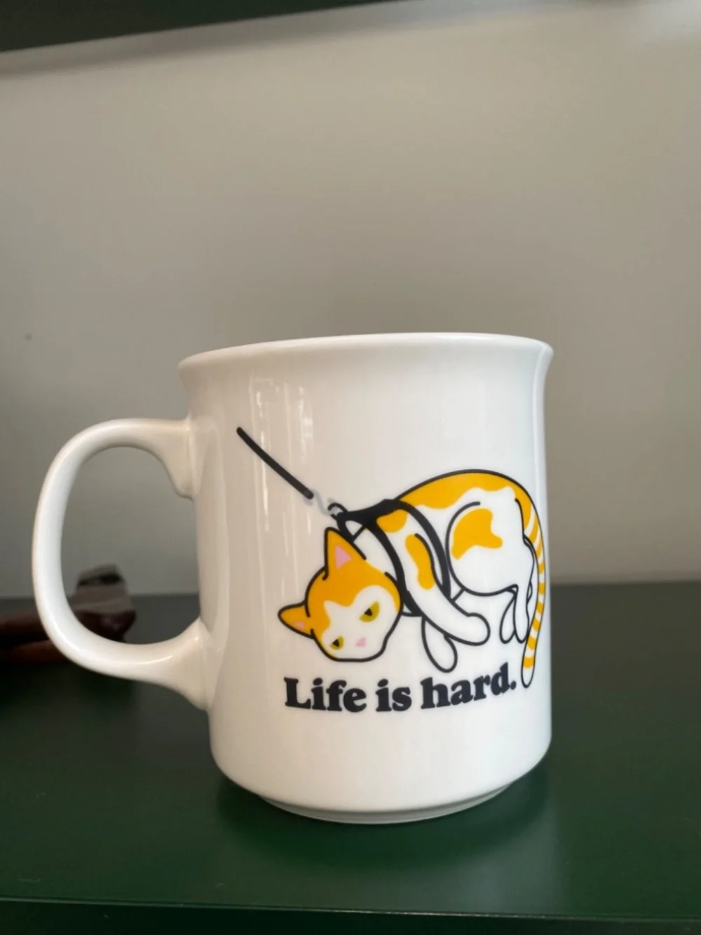 Genuine Fred “Life is hard.” cat coffee mug